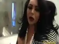 Slutty trannie Caroline jerks her hard prick in a bathroom