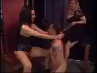 Submissive middle-aged man gets caged by the strict tranny Mistresses