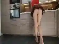 Beautiful Girl Cleaning Her Kitchen With Nude Pantyhose