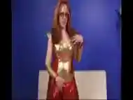 Cosplaying shemale wears a costume while jerking off