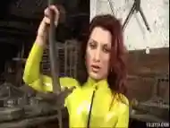 Redhead in Tight Yellow Latex