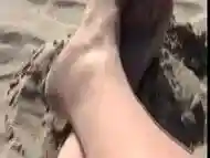 T-girl shows her manicured feet and booty at the beach