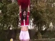 Tranny cheerleader Aly Sinclair cheerfully rides cock by the pool