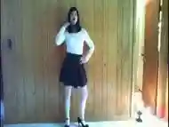 cute in black skirt and white outfit posing and riding dildo