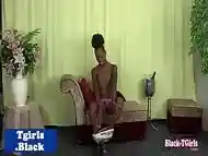 Black tgirl models large cock before tugging