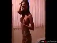 Ladyboy strips down and jerks off while giving blowjob