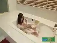 Transgender beauty pissing herself in bathtub