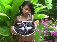 Teen Asian shemale masturbates in nature