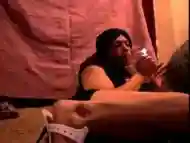 Tranny in high heels smokes while playing with herself