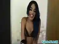 Smalltits black ts strokes her huge cock