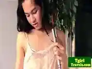 Solo ladyboy jerks her cock after getting wet